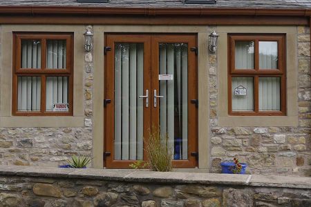 Brown upvc French doors with chrome hardware
	                    
	                    
	                    
	                    
	                    