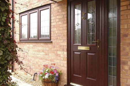 An entrance door with single glass panel in Rosewood brown colour