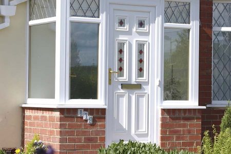 A new uPVC front door in white with decorative glass panels